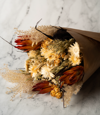 King's Day large dried flower bouquet in orange, red and cream, wrapped in paper