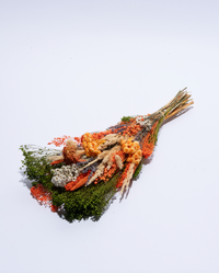 Vertical one-sided dried flower bouquet in orange and red