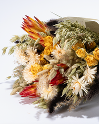 King's Day large dried flower bouquet in orange, red and cream, wrapped in paper
