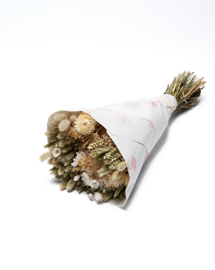 The Anita dried flower bouquet in cream, white and green, wrapped in paper