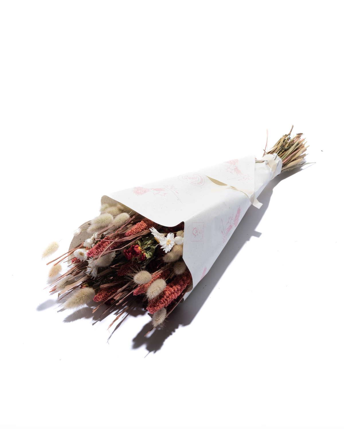 Lady in Red dried flower bouquet in red and pink, wrapped in paper