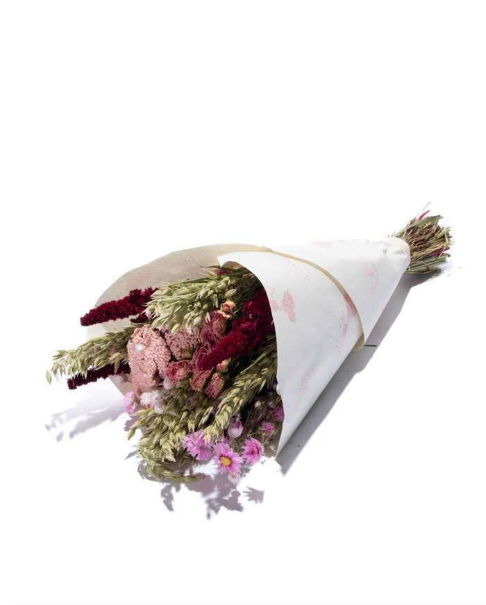 Lucky Love dried flower bouquet in pink, purple and green, wrapped in paper