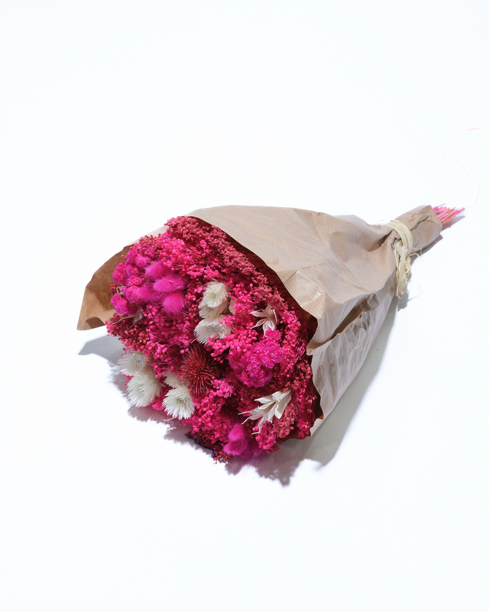 Hot Pink dried flower bouquet in hot pink and magenta, wrapped in paper