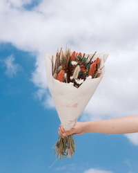 Lady in Red dried flower bouquet in red and pink, wrapped in paper