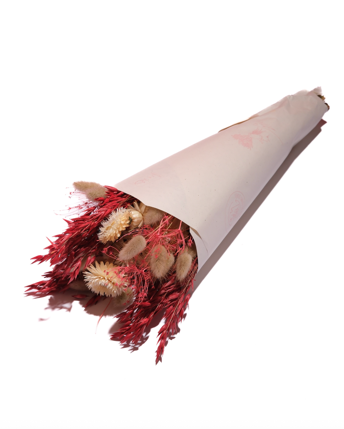 Moulin Rouge preserved flower bouquet in red and burgundy, wrapped in paper