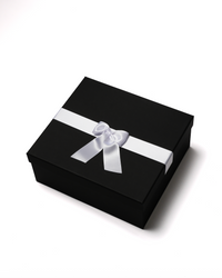 Eighteen white preserved roses in a black heart-shaped box