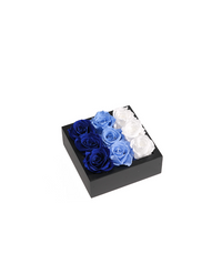 Bloombox of nine preserved roses in a square box